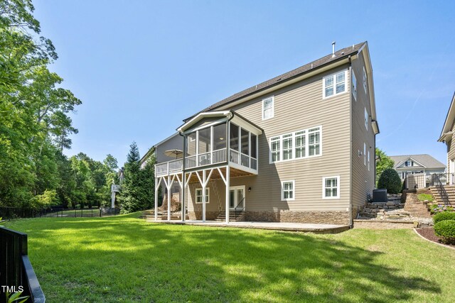117 Synandra Ln, Holly Springs, NC 27540 - rear view of house with a sunroom, stairway, central AC unit, a patio, and a wooden deck