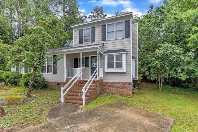 view of front of property with crawl space, a front yard, and a porch