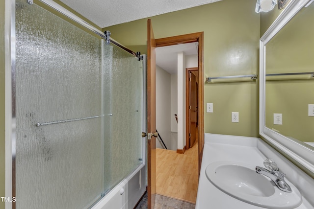 full bathroom featuring an enclosed shower and vanity
