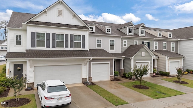 19 Willow Green Dr, Clayton, NC 27527 - townhome / multi-family property featuring a shingled roof, a garage, concrete driveway, and board and batten siding