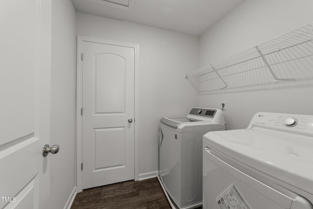 19 Willow Green Dr, Clayton, NC 27527 - laundry area featuring independent washer and dryer, dark wood-type flooring, and baseboards