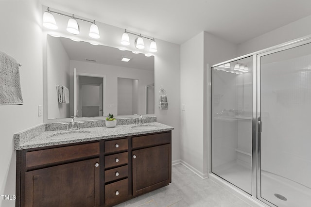 19 Willow Green Dr, Clayton, NC 27527 - bathroom with a stall shower, tile patterned floors, double vanity, and baseboards