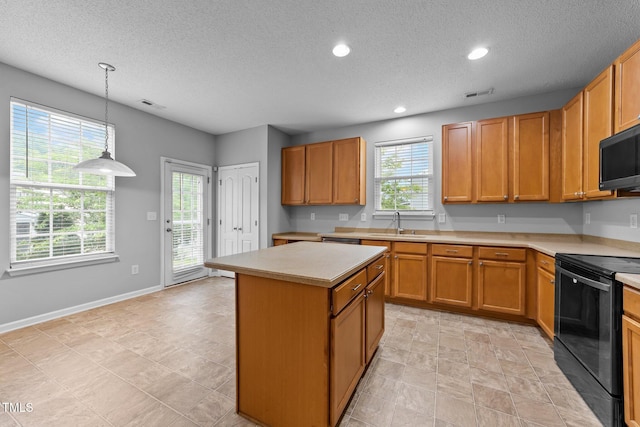 3705 Rivermist Dr, Raleigh, NC 27610 - kitchen with black appliances, light countertops, a sink, a center island, and a textured ceiling