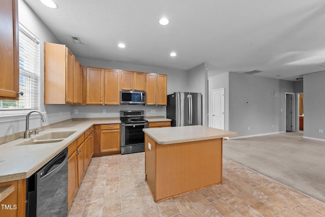 3705 Rivermist Dr, Raleigh, NC 27610 - kitchen featuring stainless steel appliances, a sink, a kitchen island, light countertops, and recessed lighting