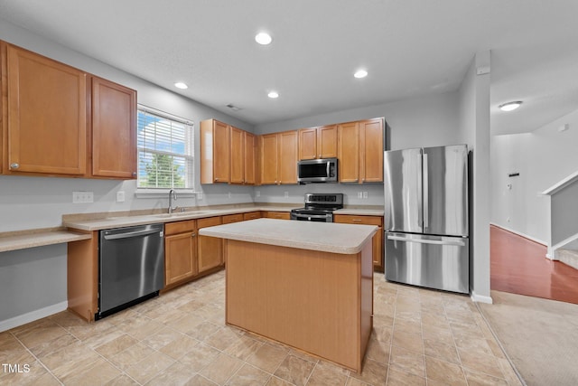 3705 Rivermist Dr, Raleigh, NC 27610 - kitchen featuring appliances with stainless steel finishes, light countertops, baseboards, recessed lighting, and a kitchen island