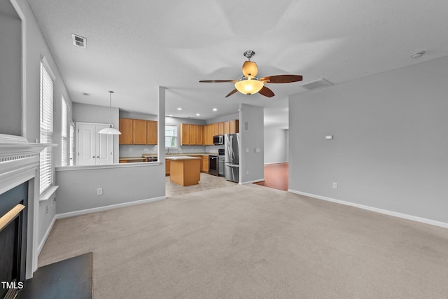 3705 Rivermist Dr, Raleigh, NC 27610 - unfurnished living room with a ceiling fan, light carpet, baseboards, and recessed lighting