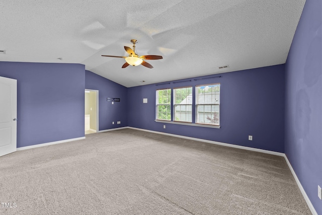 3705 Rivermist Dr, Raleigh, NC 27610 - carpeted empty room with ceiling fan, lofted ceiling, baseboards, and a textured ceiling