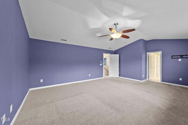 3705 Rivermist Dr, Raleigh, NC 27610 - unfurnished bedroom with lofted ceiling, baseboards, carpet flooring, a ceiling fan, and a textured ceiling