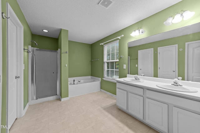3705 Rivermist Dr, Raleigh, NC 27610 - full bath with a stall shower, a bath, double vanity, a textured ceiling, and baseboards