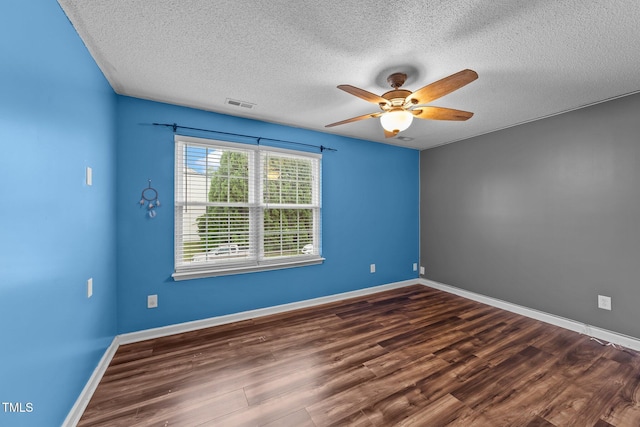 3705 Rivermist Dr, Raleigh, NC 27610 - spare room featuring a textured ceiling, dark wood-style floors, a ceiling fan, and baseboards