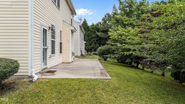 3705 Rivermist Dr, Raleigh, NC 27610 - view of grassy yard featuring a patio