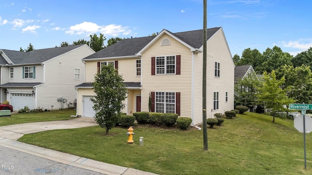 3705 Rivermist Dr, Raleigh, NC 27610 - traditional home with an attached garage, concrete driveway, and a front lawn