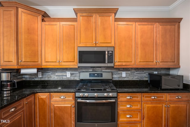 1218 Crystalwater Dr, Fuquay Varina, NC 27526 - kitchen featuring appliances with stainless steel finishes, ornamental molding, tasteful backsplash, brown cabinets, and dark stone counters