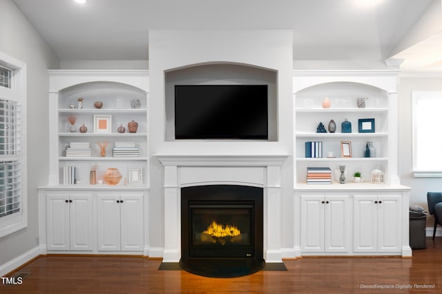 1218 Crystalwater Dr, Fuquay Varina, NC 27526 - unfurnished living room featuring dark wood-type flooring, a fireplace with flush hearth, and built in shelves