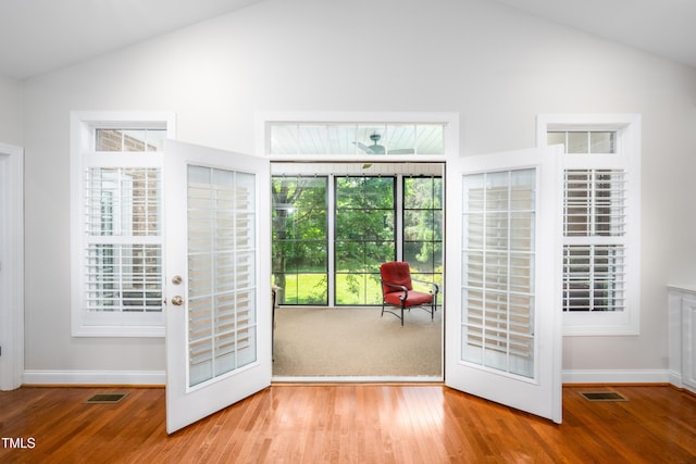 1218 Crystalwater Dr, Fuquay Varina, NC 27526 - doorway to outside featuring baseboards, wood finished floors, and high vaulted ceiling
