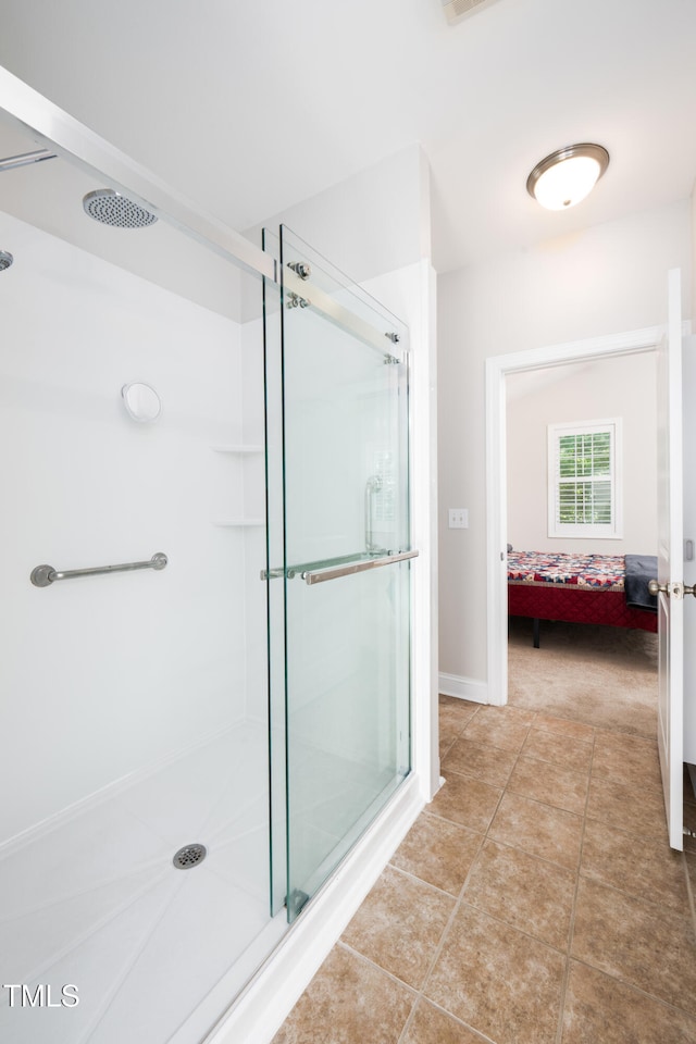 1218 Crystalwater Dr, Fuquay Varina, NC 27526 - ensuite bathroom featuring a stall shower and tile patterned floors