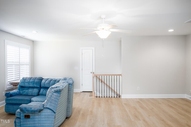1218 Crystalwater Dr, Fuquay Varina, NC 27526 - living area featuring light wood-style flooring, baseboards, an upstairs landing, ceiling fan, and recessed lighting