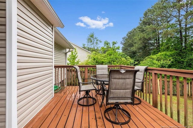 deck with outdoor dining area