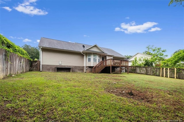 back of property with stairs and a deck