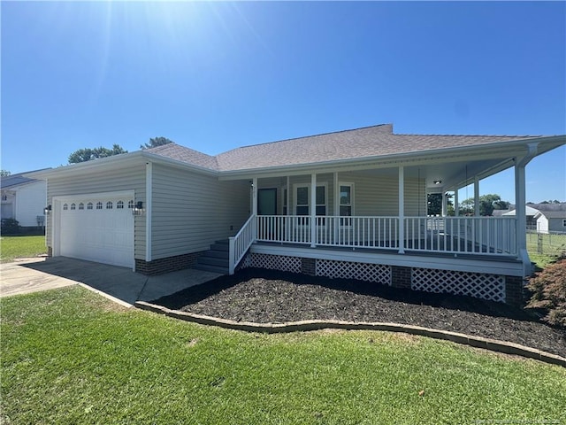 303 Nash Rd, Saint Pauls, NC 28384 - view of front of house featuring covered porch, a garage, driveway, a front yard, and roof with shingles
