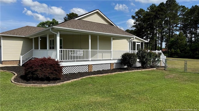 303 Nash Rd, Saint Pauls, NC 28384 - view of home's exterior featuring a shingled roof and covered porch