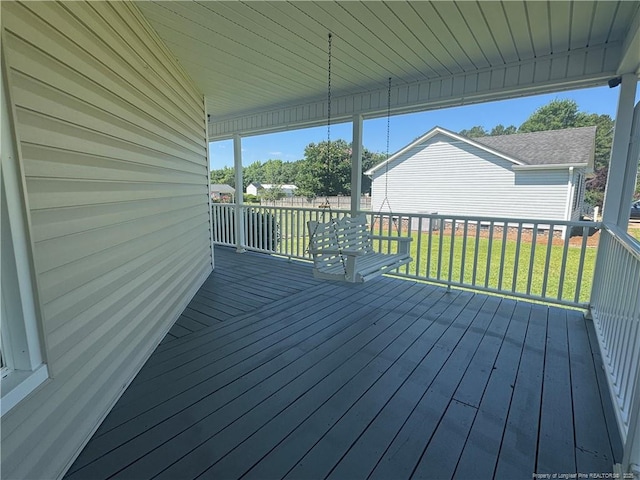 303 Nash Rd, Saint Pauls, NC 28384 - wooden deck featuring a lawn
