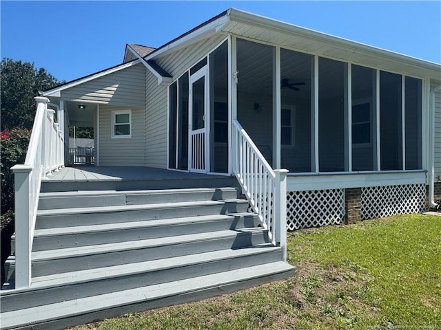 303 Nash Rd, Saint Pauls, NC 28384 - property entrance with a yard, ceiling fan, and a porch