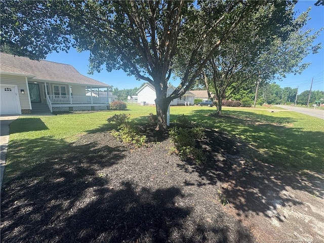 303 Nash Rd, Saint Pauls, NC 28384 - view of grassy yard featuring a porch