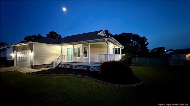303 Nash Rd, Saint Pauls, NC 28384 - view of front of property with covered porch, an attached garage, a yard, and concrete driveway