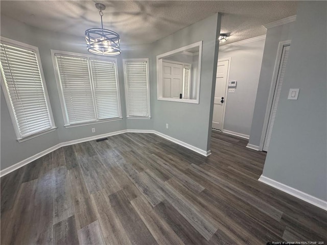 303 Nash Rd, Saint Pauls, NC 28384 - unfurnished dining area with a chandelier, dark wood-style floors, baseboards, and a textured ceiling