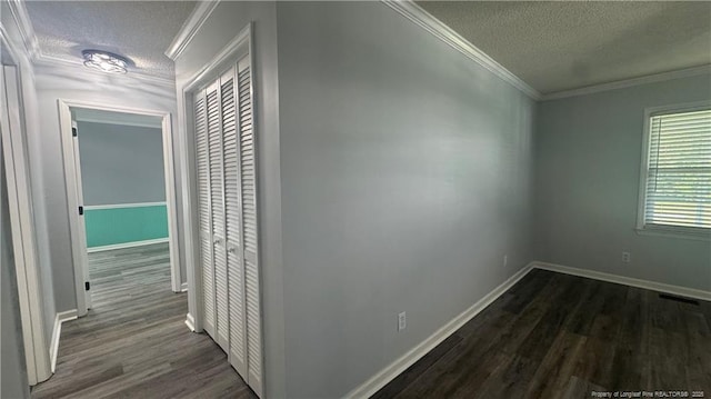 303 Nash Rd, Saint Pauls, NC 28384 - corridor featuring a textured ceiling, dark wood-style flooring, crown molding, and baseboards