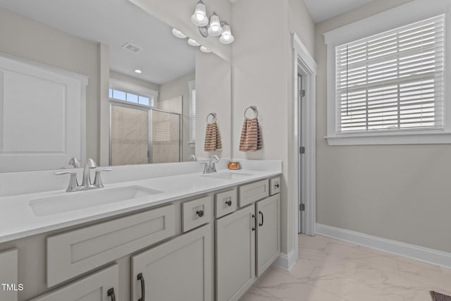 2096 Dowell Ct, Burlington, NC 27215 - bathroom with marble finish flooring, a stall shower, baseboards, and double vanity