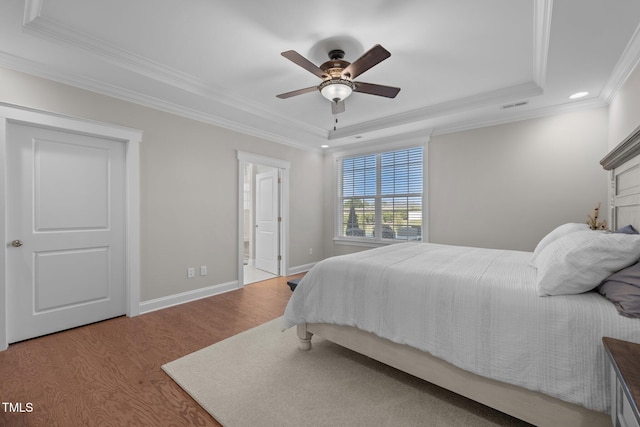 2096 Dowell Ct, Burlington, NC 27215 - bedroom featuring a tray ceiling, wood finished floors, ornamental molding, recessed lighting, and baseboards