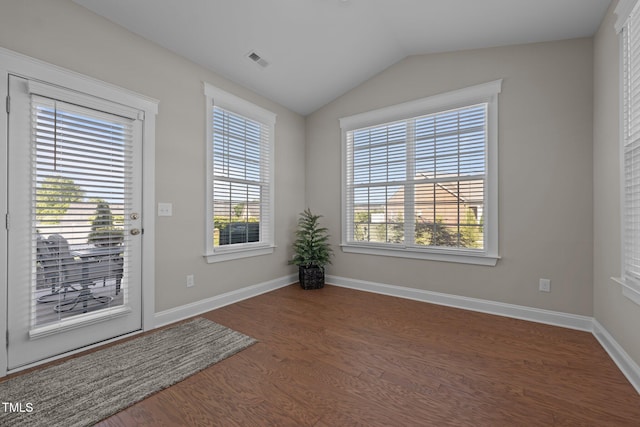 2096 Dowell Ct, Burlington, NC 27215 - empty room with wood finished floors, baseboards, and vaulted ceiling