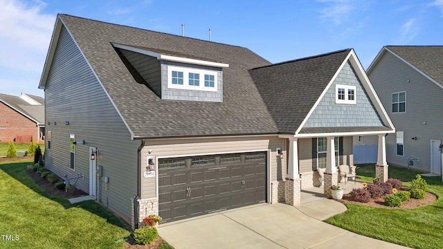 2096 Dowell Ct, Burlington, NC 27215 - view of front of property featuring a porch, a front lawn, concrete driveway, and roof with shingles