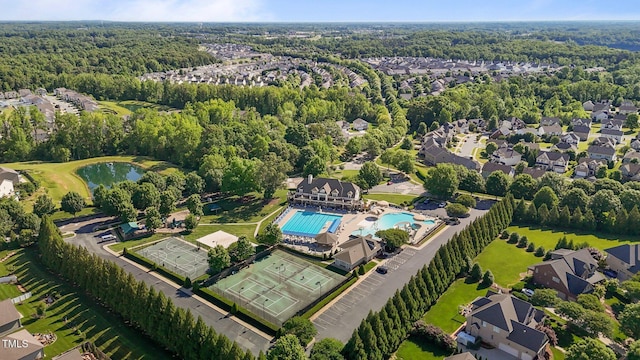 2096 Dowell Ct, Burlington, NC 27215 - view of property location with a nearby body of water, a heavily wooded area, a pool area, and nearby suburban area