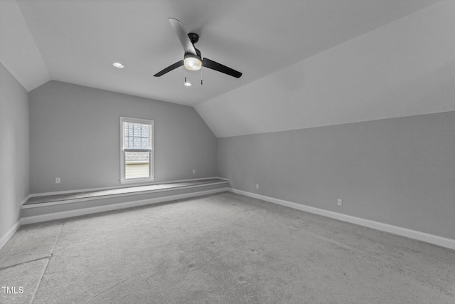 additional living space featuring lofted ceiling, a ceiling fan, carpet, baseboards, and recessed lighting
