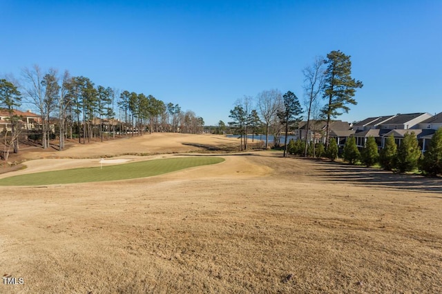 view of property's community featuring a residential view, golf course view, and a putting area