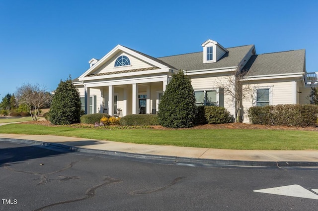 neoclassical / greek revival house with a front yard