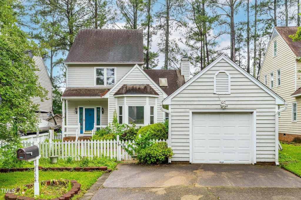 1724 Briarforest Pl, Raleigh, NC 27615 - view of front of house with a garage, asphalt driveway, and a shingled roof