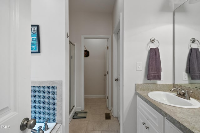 100 Jonathans Pl, Goldsboro, NC 27534 - full bath with a stall shower, vanity, baseboards, and tile patterned flooring