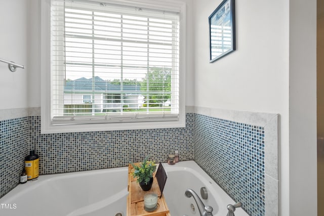 100 Jonathans Pl, Goldsboro, NC 27534 - bathroom with a jetted tub, a wainscoted wall, and tile walls