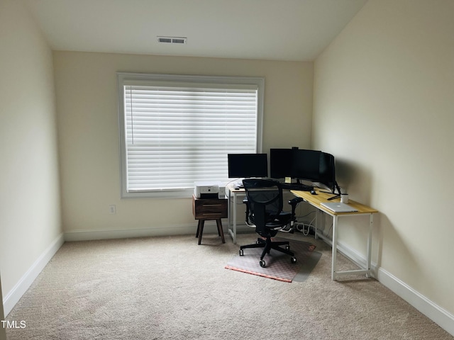 carpeted office space with baseboards