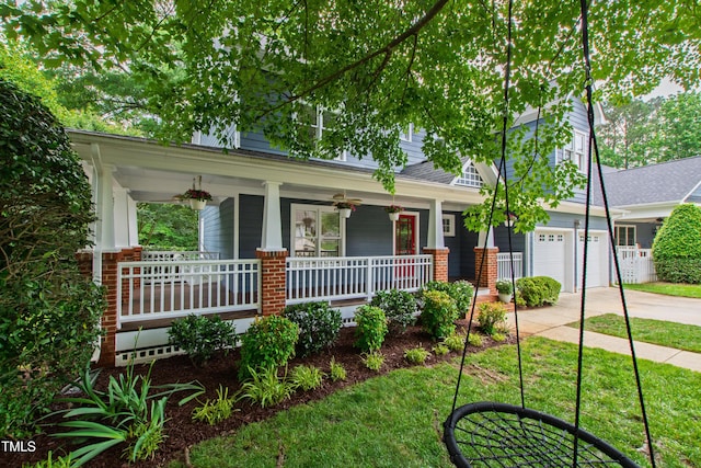 view of front of house with covered porch, concrete driveway, and an attached garage