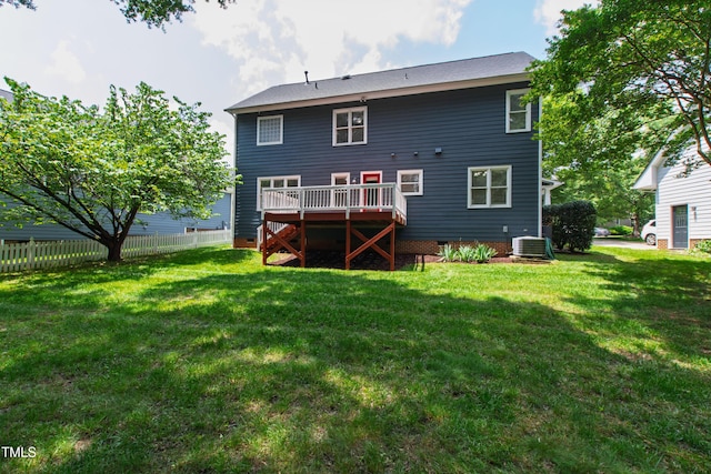 rear view of property featuring a wooden deck and cooling unit