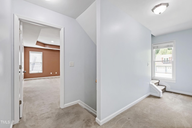 hall with carpet and baseboards