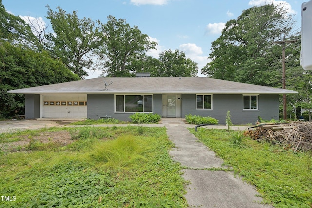 single story home with an attached garage and driveway