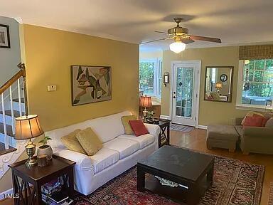 living area with a ceiling fan