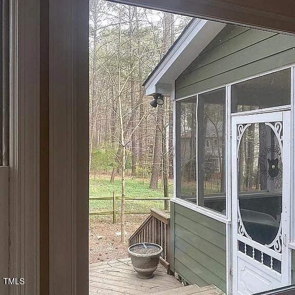 view of home's exterior featuring a sunroom