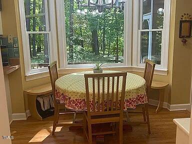 sunroom featuring a chandelier
